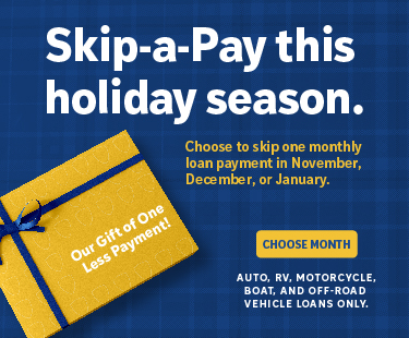 Family having a barbecue in their yard.